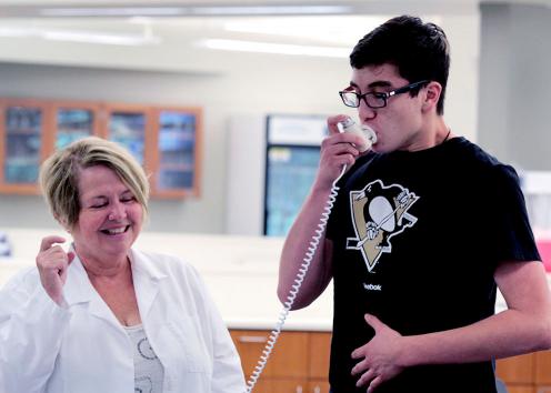 Student tests lung capacity